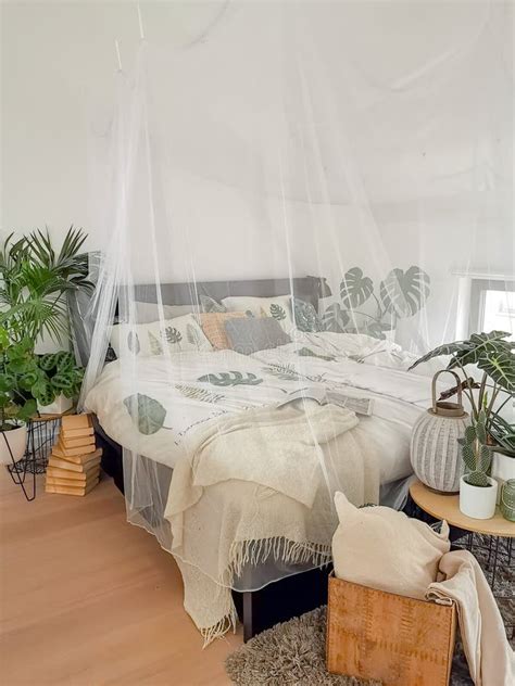 Bright White Bedroom Filled with Numerous Houseplants and Flooded in ...