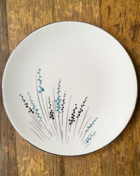 Knowles Fantasy six piece bread plate set. The blue and black floral ...