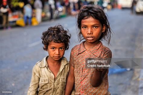 Poor Indian Children Asking For Help High-Res Stock Photo - Getty Images