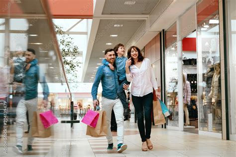 Family Shopping. Happy People In Mall Stock Photo | Adobe Stock