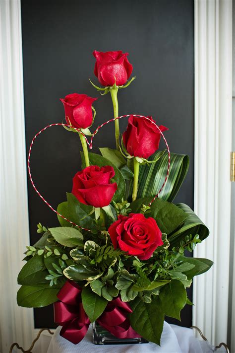 A stunning and unique Valentine's Day arrangement created with red ...