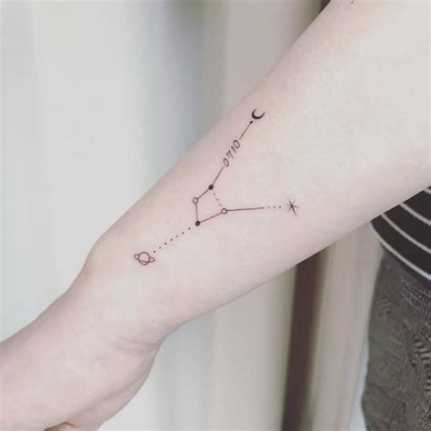 Cancer constellation tattoo on the wrist.