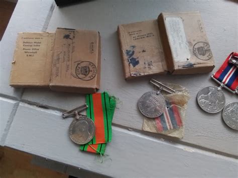 A Collection Of World War Two Medals And Vets Badges With Paperwork ...