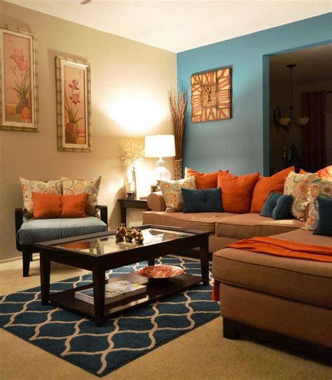 living room orange and brown teal art gallery wall by carolyncochrane ...