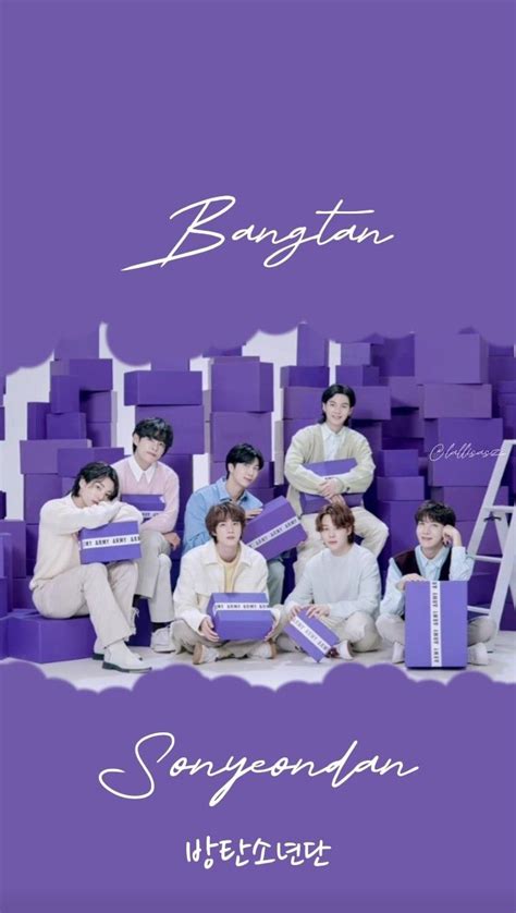 the group is posing for a photo in front of purple boxes with white ...