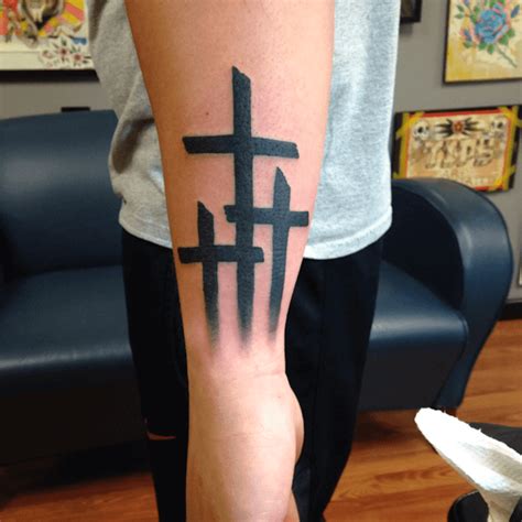 Exploring the Varied Meanings of 3 Cross Tattoos - Theorganicvibes - Medium