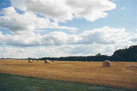 Hayfield with Hay Bales | Nature Stock Photos ~ Creative Market