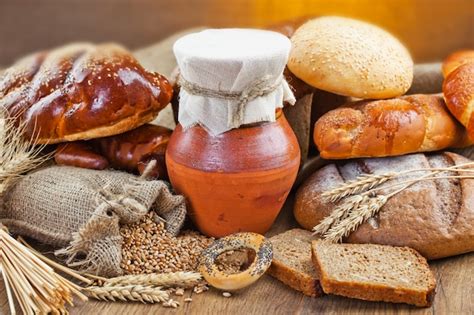 Premium Photo | Bread and wheat on a wooden background