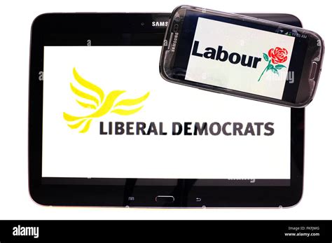 A tablet with the Lib Dem logo on it and a smartphone with the Labour ...