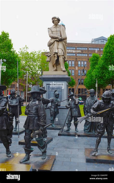 Statue of Rembrandt surrounded by figures from his painting The Night ...