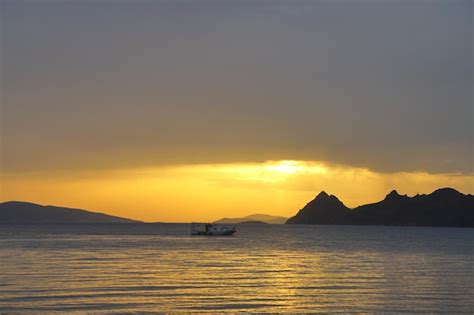 Premium Photo | Sunset on the beach seaside town of turgutreis and ...