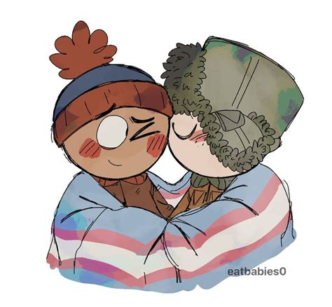 two people are hugging each other while wearing winter hats and scarves ...