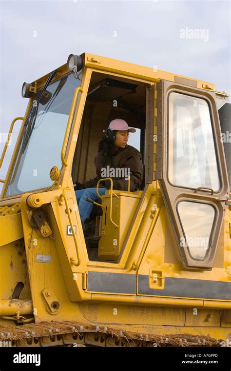 Female bulldozer operator Stock Photo - Alamy