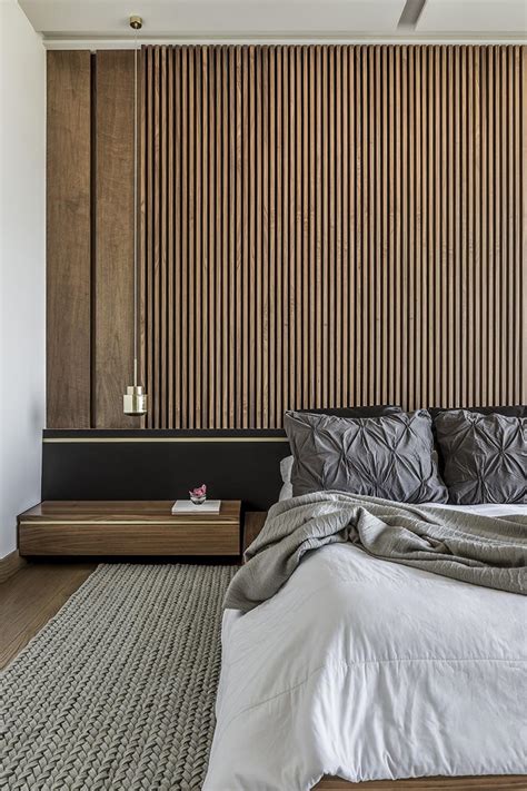 An Accent Wall Of Vertical Wood Helps To Accentuate The Feeling Of ...