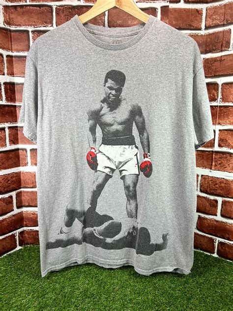 Muhammad Ali Official Merchandise ALI Knockout KO T-S… - Gem