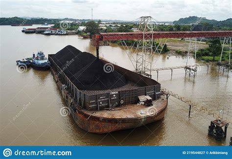 Loading Coal From Cargo Barges Onto A Bulk Carrier Using Ship Cranes ...