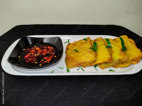 Mendoan, Indonesian traditional food. Tempe covered in flour, fried and ...