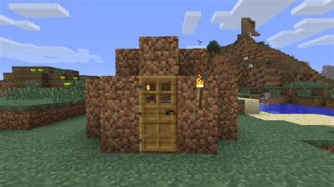 a small house made out of rocks and wood in the middle of a minecraft ...