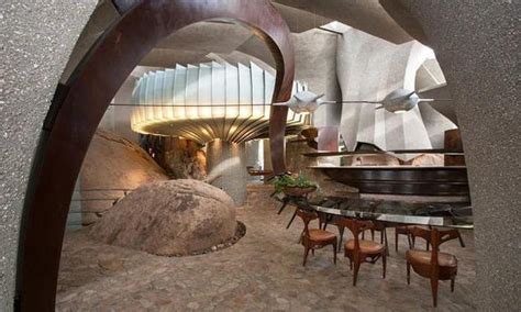 Cave Like Modern House Design Boundlessly Blending with Desert Rocks