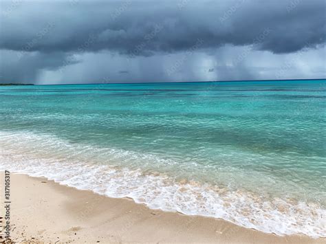 Cloudy day on the beach. Rain on the coast during a beach holiday ...