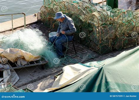 Fisher Clinches the Fishing Net Editorial Stock Image - Image of fire ...