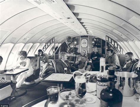 Drinks are served on Qantas' first class cabin on their Boeing 707 in ...