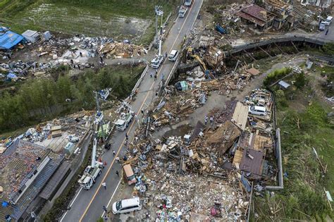 Typhoon toll in Japan rises as dramatic rescues continue