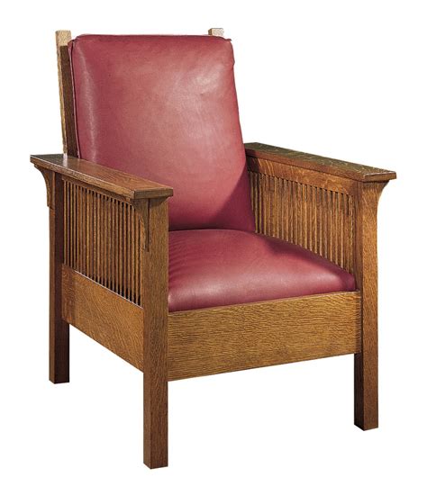 a wooden chair with red leather upholstered on the back and armrests