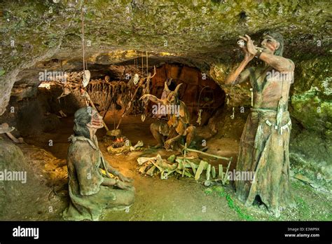 Prehistoric Cro-Magnon shamen and woman in cave at Grottes du Roc de ...