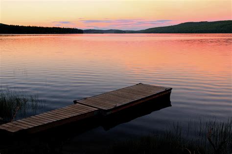 Scenic Lake And Dock At Sunset Photograph by Wildroze - Fine Art America