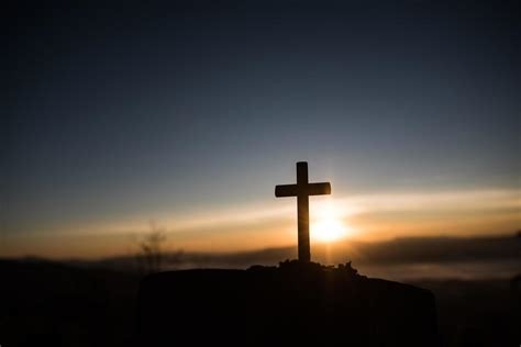 Silhouette of catholic cross and sunrise 3613245 Stock Photo at Vecteezy