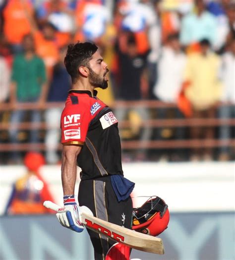 Royal Challengers Bangalore batsman Virat Kohli of celebrates his half ...