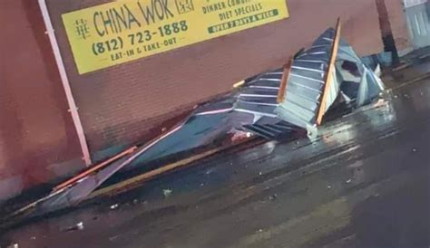 Early morning storm damage tears off awnings, knocks down signs in ...