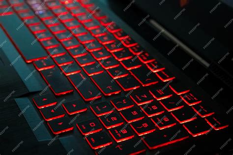 Premium Photo | Red backlight on a modern keyboard of gaming laptop in ...