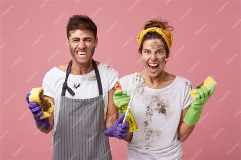 Free Photo | Irritated male and woman from cleaning service wearing ...