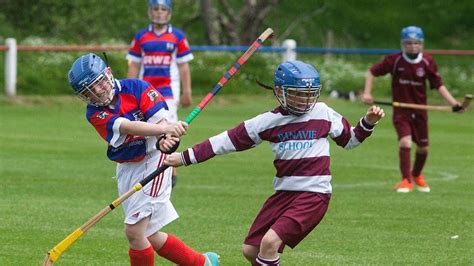 Shinty helmet rules to apply to more young players - BBC News