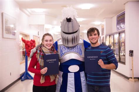 Mallory Colton and Abel Zavitz pose with their letters of acceptance ...