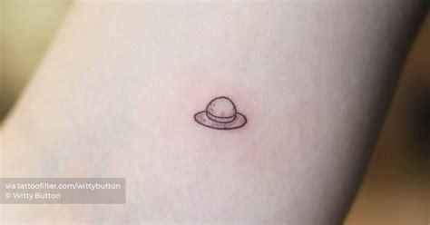 Tiny Luffy's hat tattoo located on the inner arm.