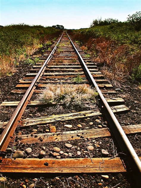 Down The Rails is a photograph by Don Schimmel. An abandoned old train ...