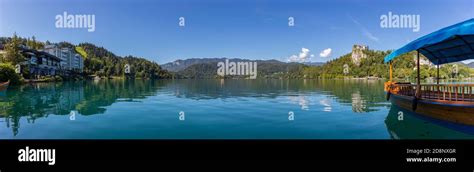 A panorama picture of Lake Bled, showcasing one of the gondolas (named ...