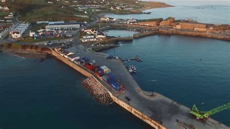 Flight around Alderney Harbour at sunrise - YouTube