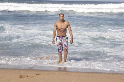 Sexy Black man at the beach walking Stock Photo by ©Corlie 42499249