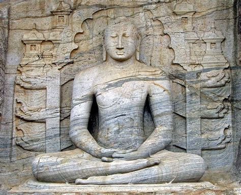 The seated image, which depicts the Buddha in meditative posture with ...