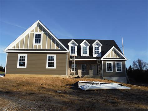 Front of the house with James Hardie Monterey Taupe Board & Batten ...