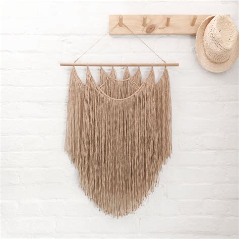 Natural wall hanging by Dear Musketeer. This gorgeous jute wall hanging ...