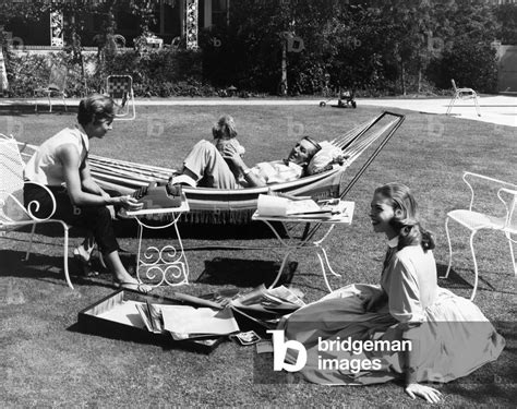 Walt Disney (center) at home with his daughters Diane Disney (left) and ...