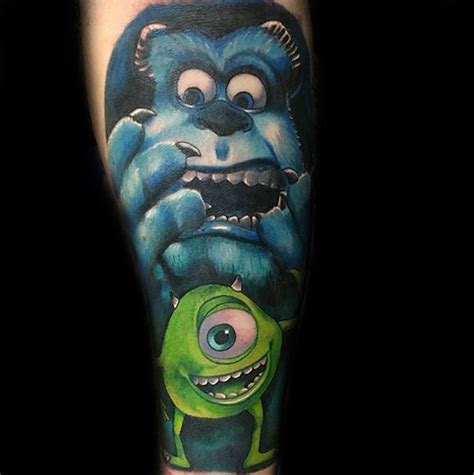 a man with a tattoo on his leg has an image of monsters in blue and green