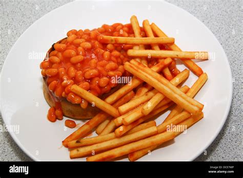 Scotch pie beans and chips meal Stock Photo - Alamy