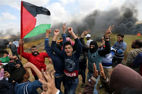 At least 14 dead, hundreds wounded during Gaza protests | PBS News