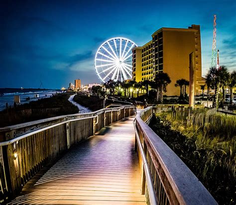 Myrtle Beach Boardwalk At Night Photograph by David Smith